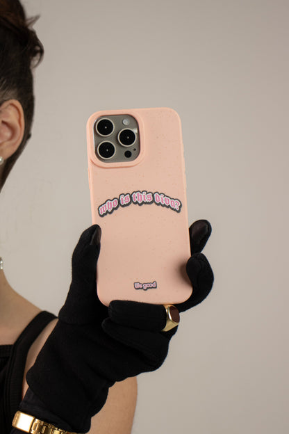 Woman With a black dress wearing black gloves holding a We Good Tpu iPhone case with wheat mix speckled in a flamingo pink color with a pink, white and black 'who is this diva?' gothic text print.